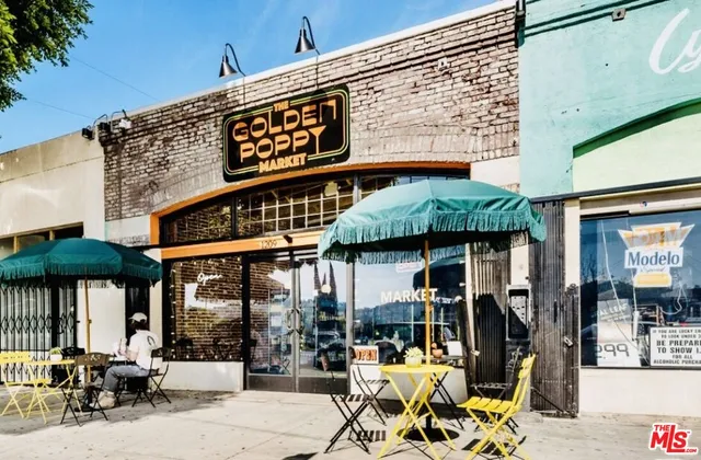 a view of a cafe with sitting area
