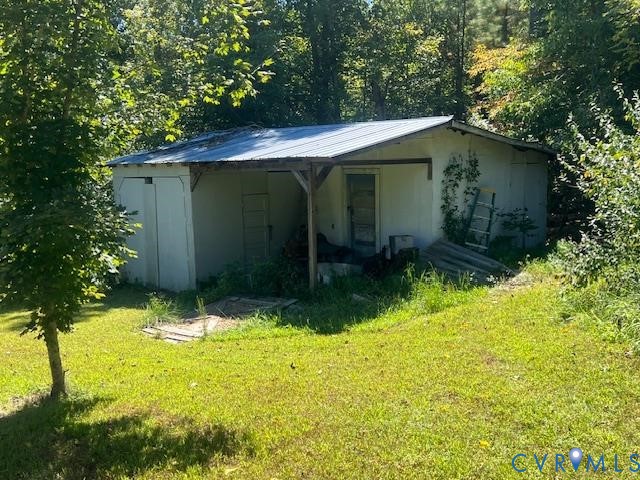 346-278 Trinity Road Keysville, VA 23947 - Photo 12 of 30 a backyard of a house with yard and garage