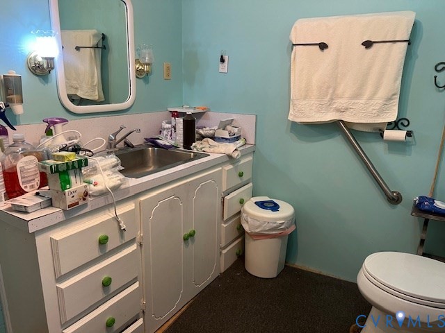 346-278 Trinity Road Keysville, VA 23947 - Photo 23 of 30 a bathroom with a toilet sink and mirror