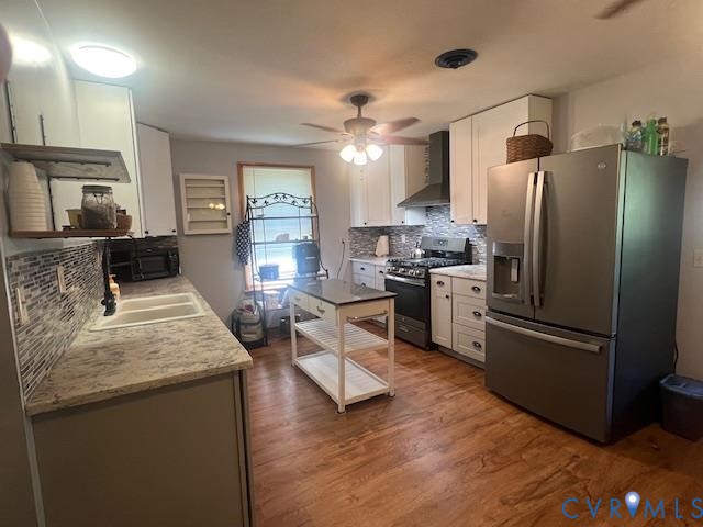 346-278 Trinity Road Keysville, VA 23947 - Photo 3 of 30 a kitchen with stainless steel appliances granite countertop a refrigerator a stove a sink dishwasher and a refrigerator with wooden floor
