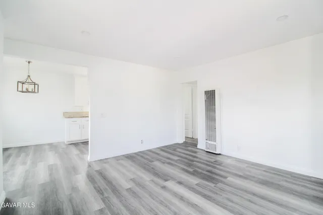a view of room with wooden floor