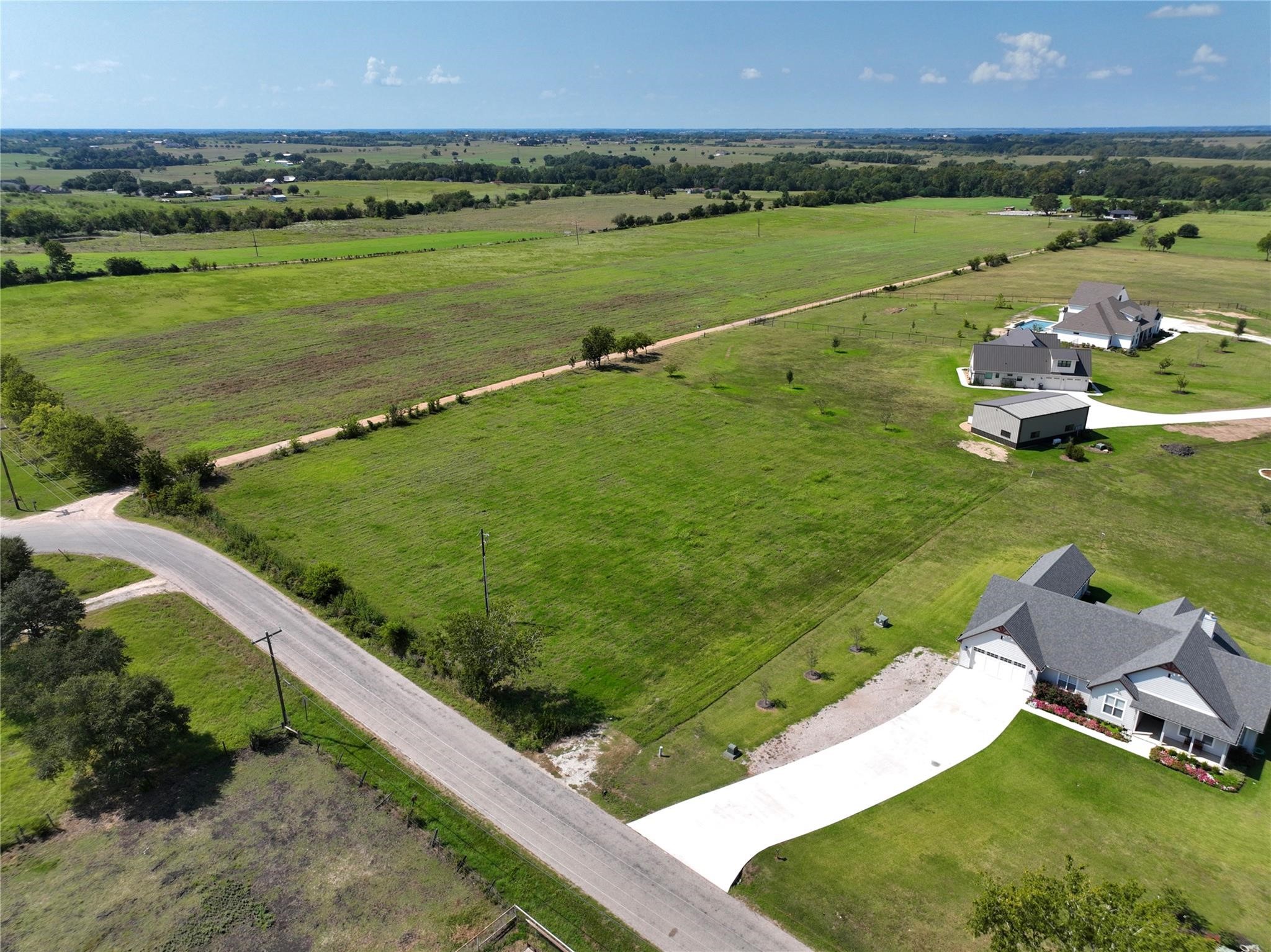 3888 Wonder Hill Road Brenham, TX 77833 - Photo 3 of 6 a view of a lake with a city