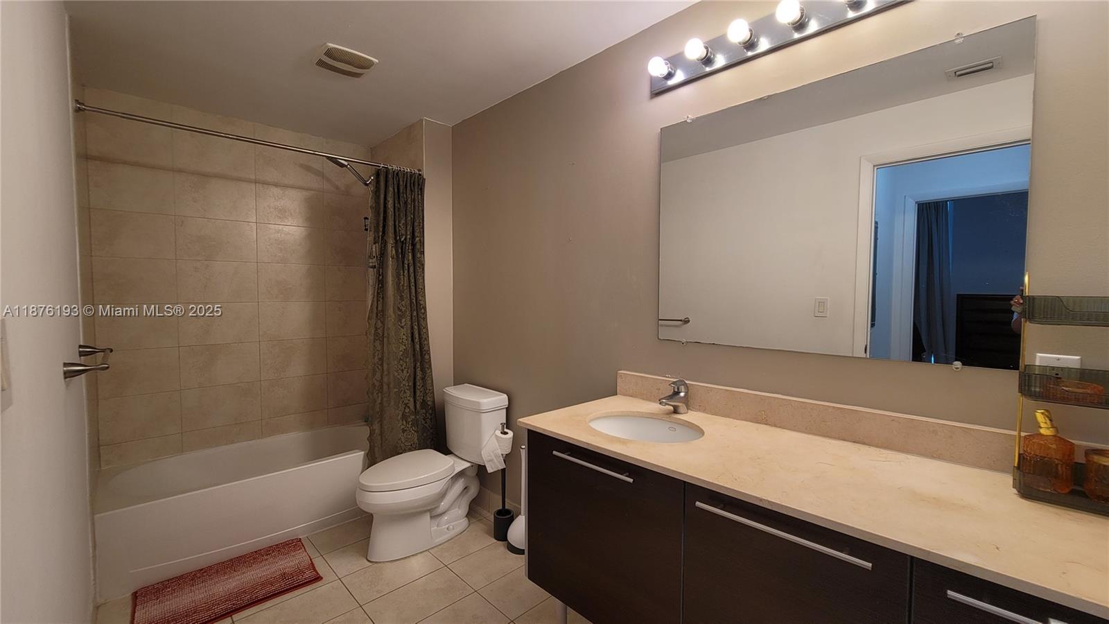 1900 North Bayshore Drive, Unit 2009 Miami, FL 33132 - Photo 12 of 26 a bathroom with a sink a toilet and shower