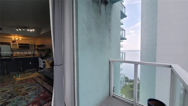 a bathroom with a glass shower door and a window