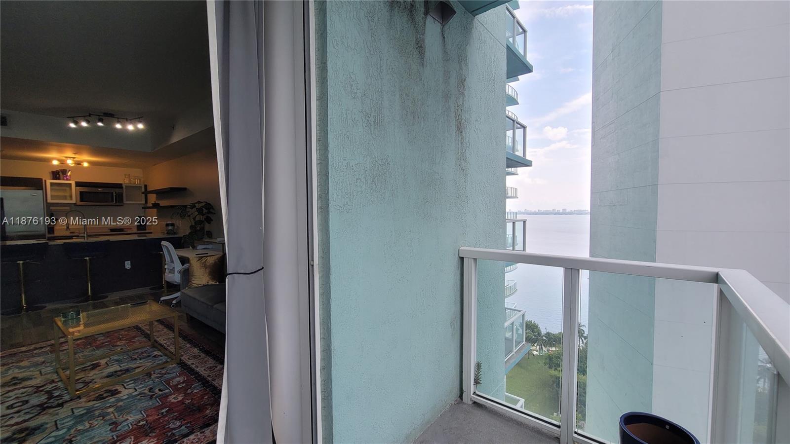 1900 North Bayshore Drive, Unit 2009 Miami, FL 33132 - Photo 17 of 26 a bathroom with a glass shower door and a window