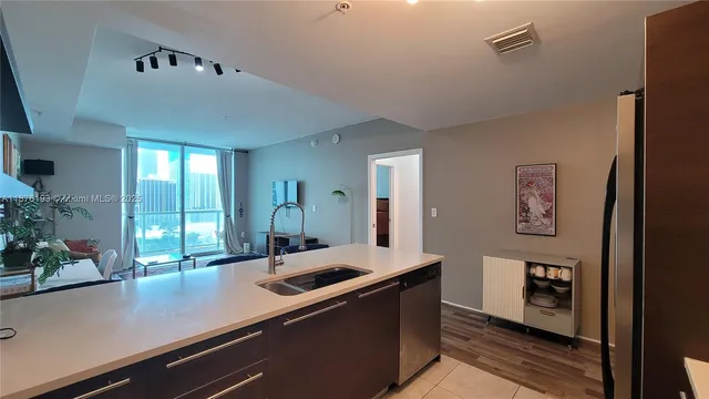 a view of a center kitchen island with cabinets