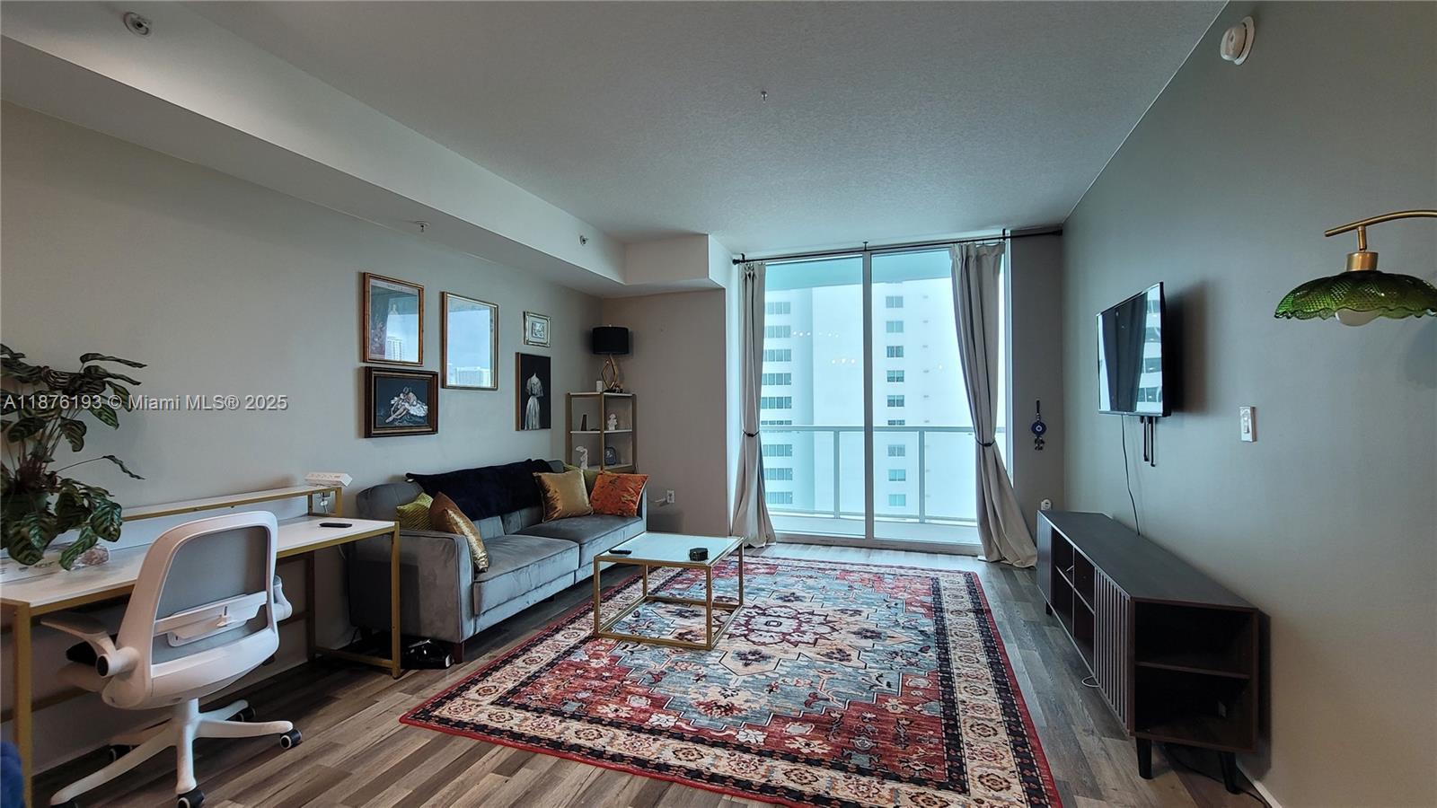 1900 North Bayshore Drive, Unit 2009 Miami, FL 33132 - Photo 5 of 26 a bedroom with furniture and a rug