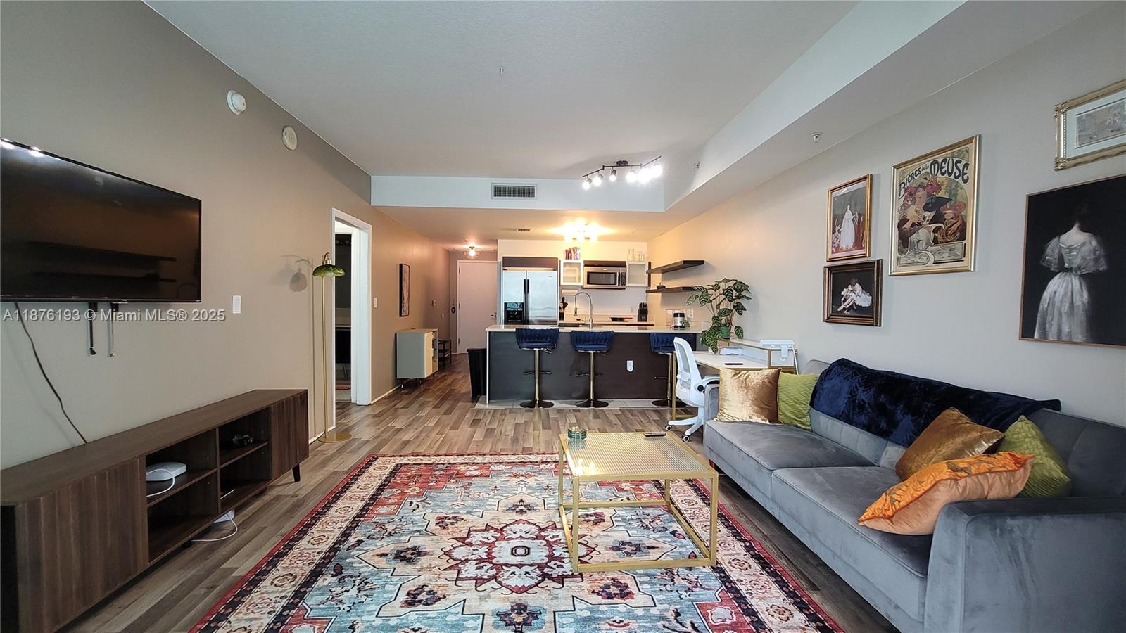 1900 North Bayshore Drive, Unit 2009 Miami, FL 33132 - Photo 6 of 26 a living room with furniture and a flat screen tv