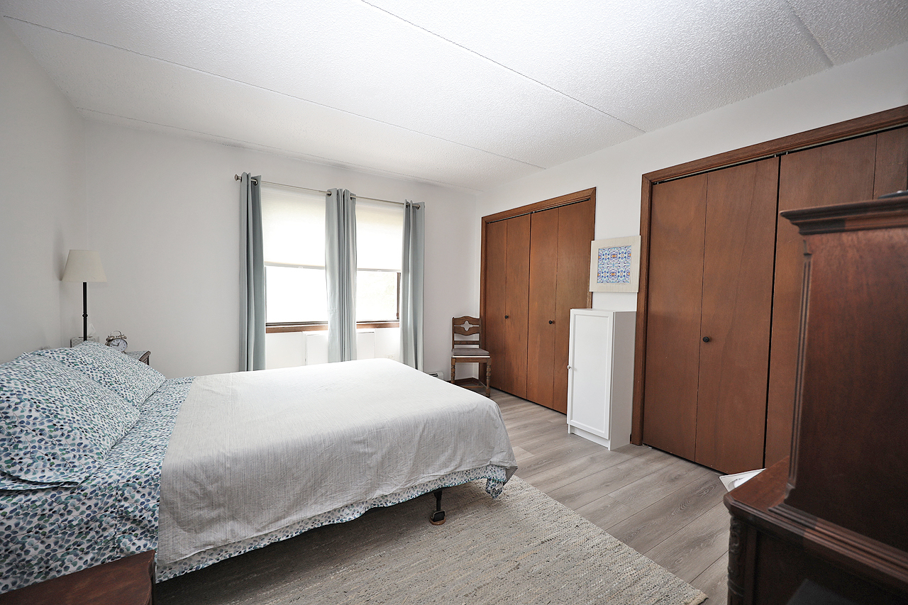 4946 Douglas Road, Unit 202 Downers Grove, IL 60515 - Photo 13 of 19 a bedroom with a bed and a window
