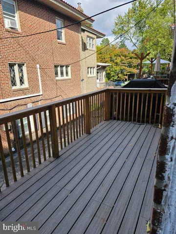a balcony view with wooden floor