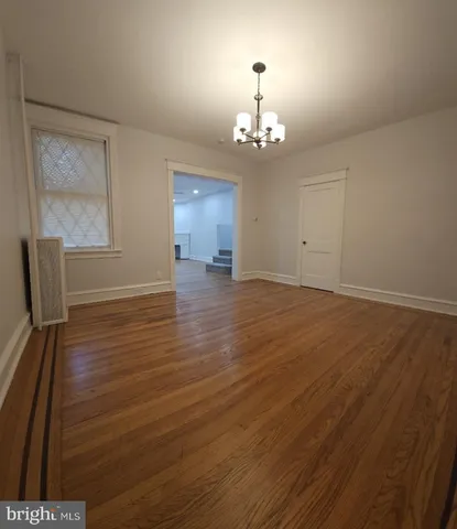 a view of livingroom with hardwood floor and hallway
