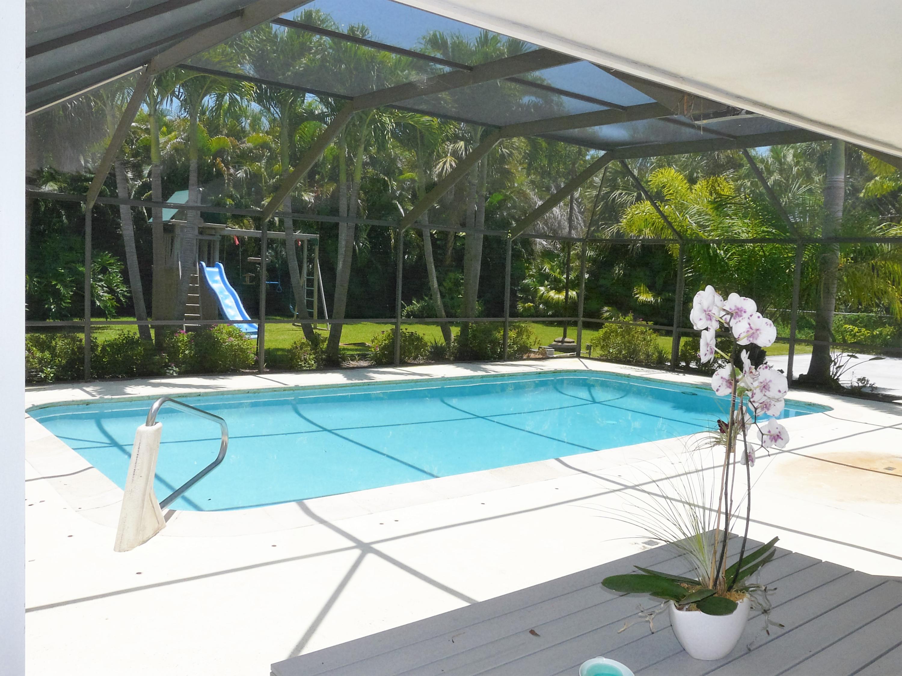 1120 Southwest 15th Street Boca Raton, FL 33486 - Photo 11 of 32 a view of a park with swings and potted plants