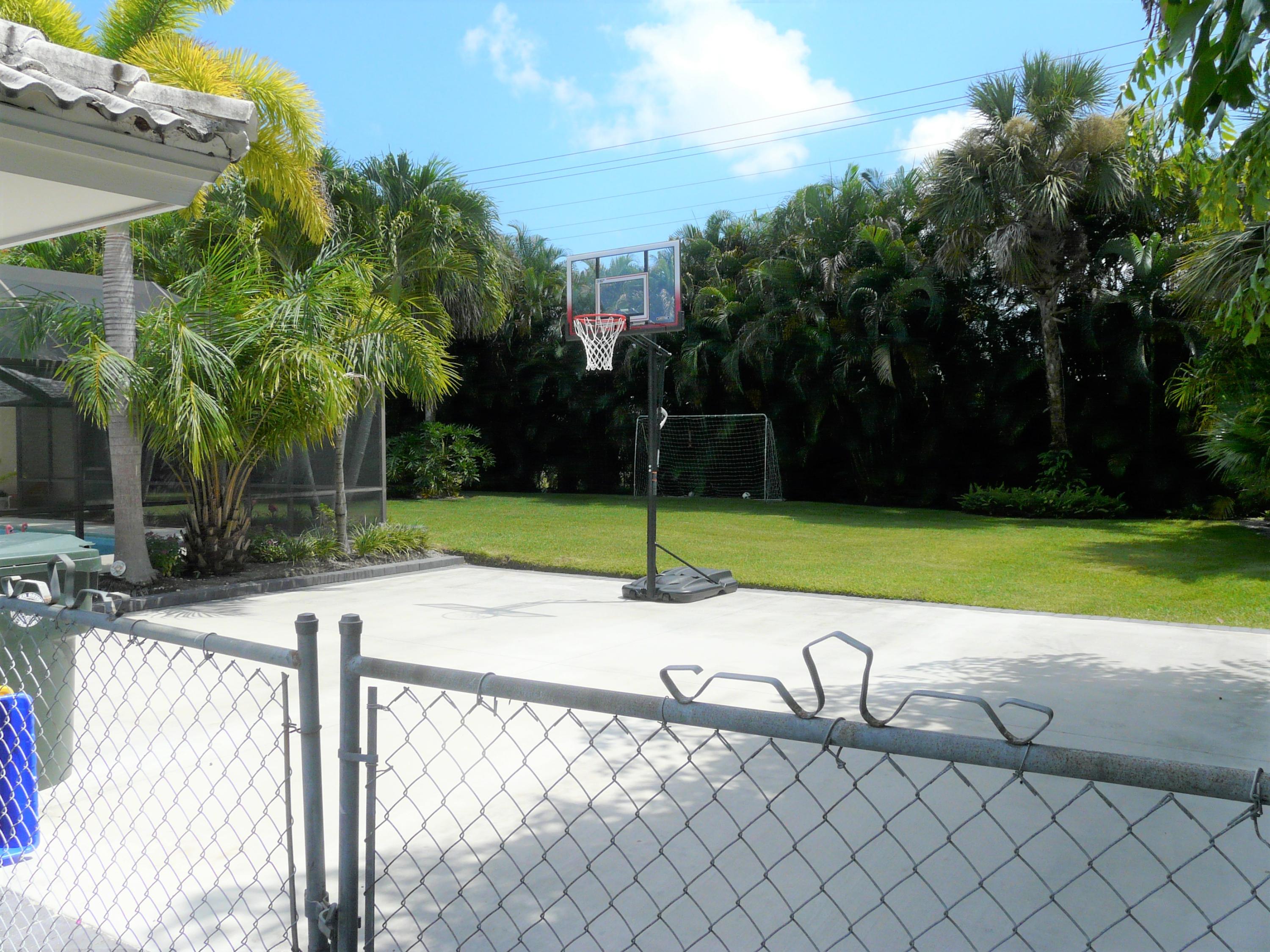 1120 Southwest 15th Street Boca Raton, FL 33486 - Photo 13 of 32 a view of a chair and table in the backyard
