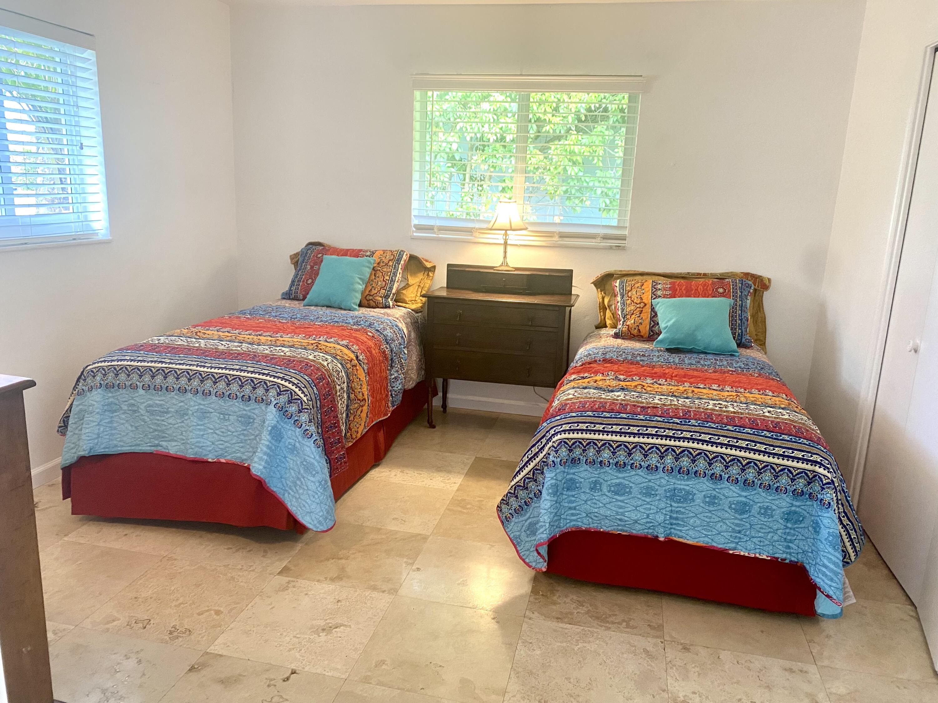 1120 Southwest 15th Street Boca Raton, FL 33486 - Photo 18 of 32 a bedroom with bed and a window
