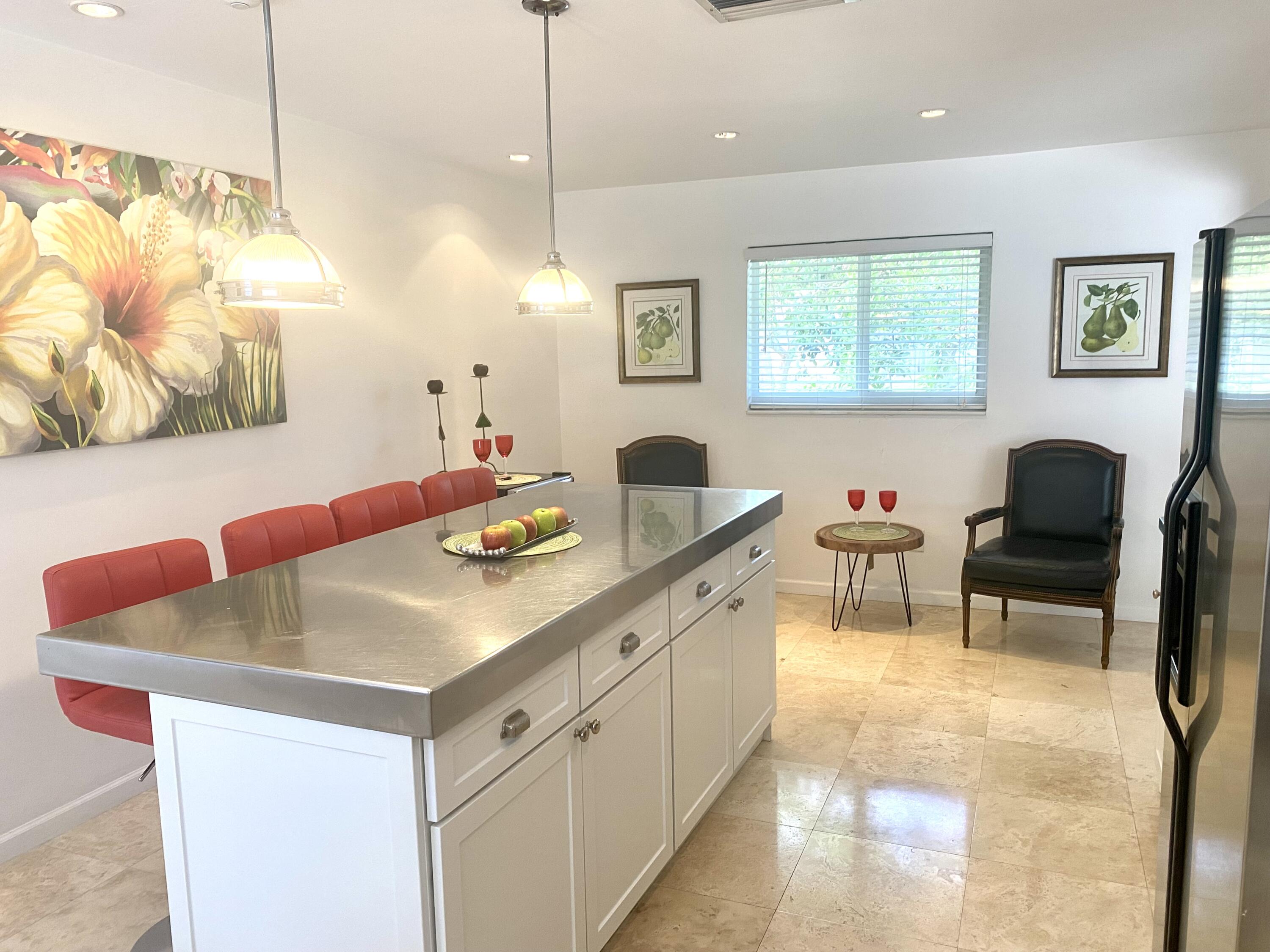 1120 Southwest 15th Street Boca Raton, FL 33486 - Photo 9 of 32 a kitchen with a sink a counter space and living room