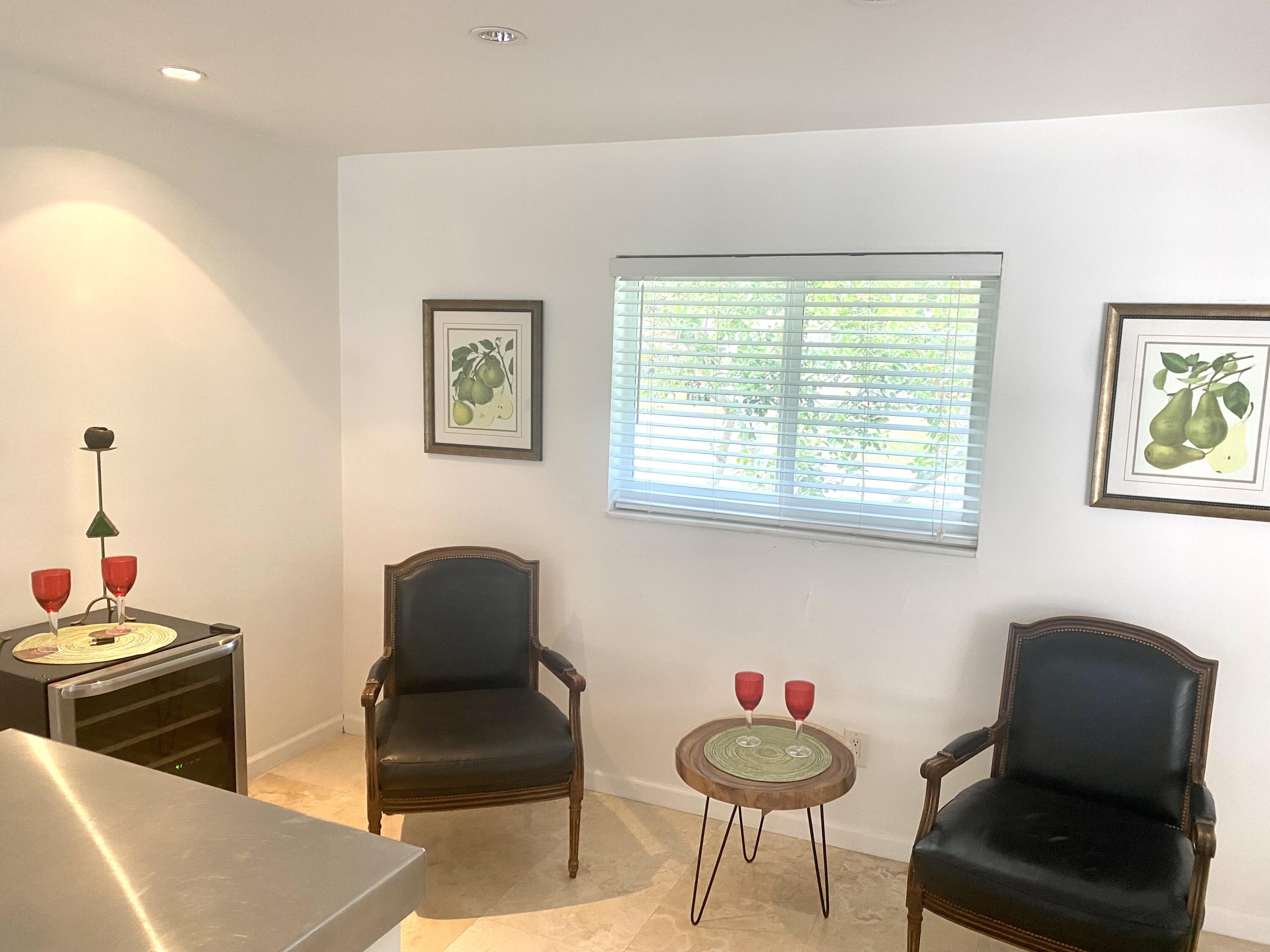 1120 Southwest 15th Street Boca Raton, FL 33486 - Photo 10 of 32 a living room with furniture and a chair
