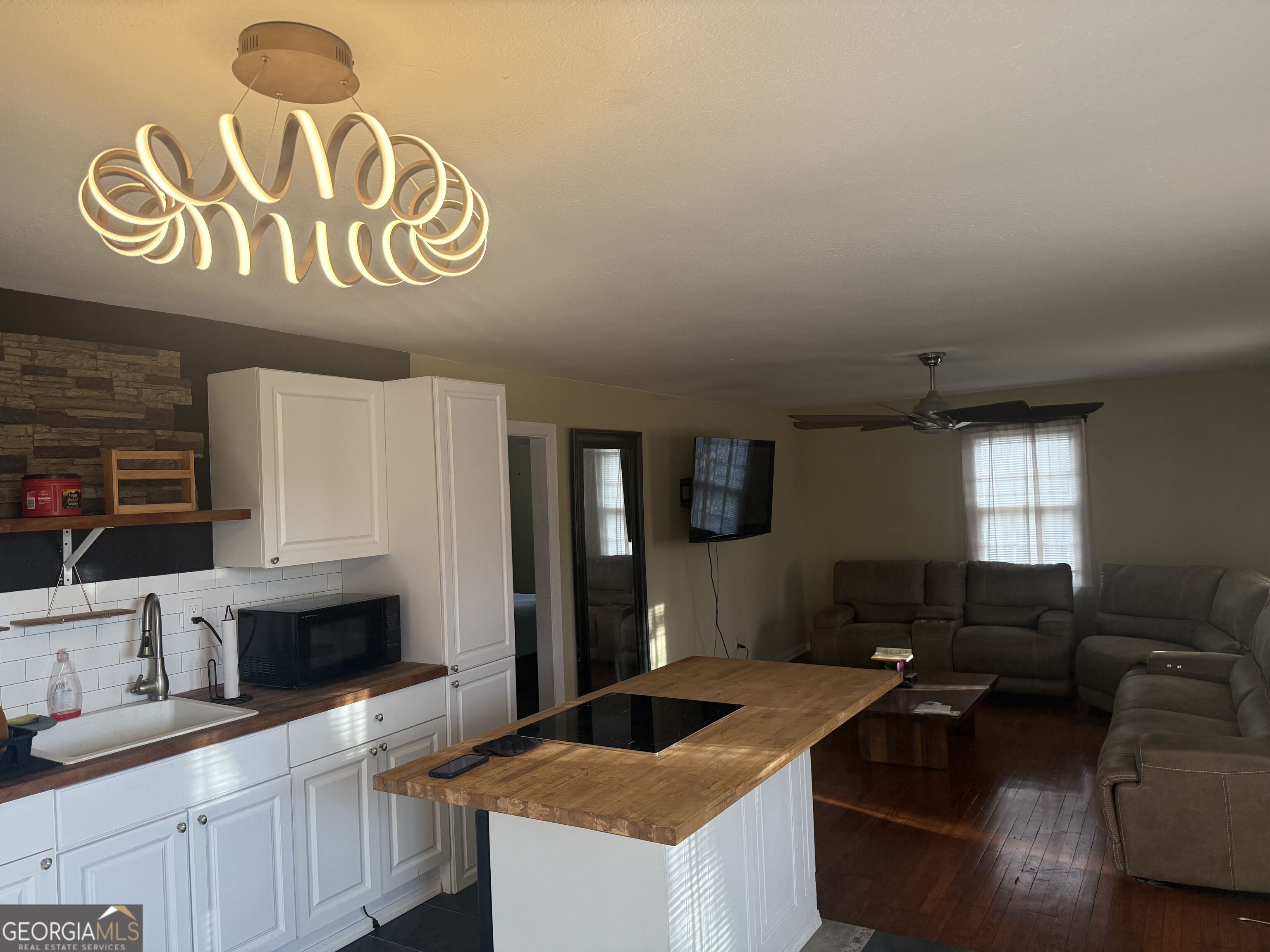 3861 Newnan Road Griffin, GA 30223 - Photo 12 of 89 a kitchen with a stove and a sink