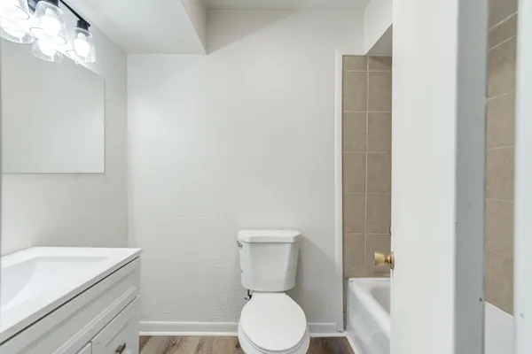 a bathroom with a toilet and a sink