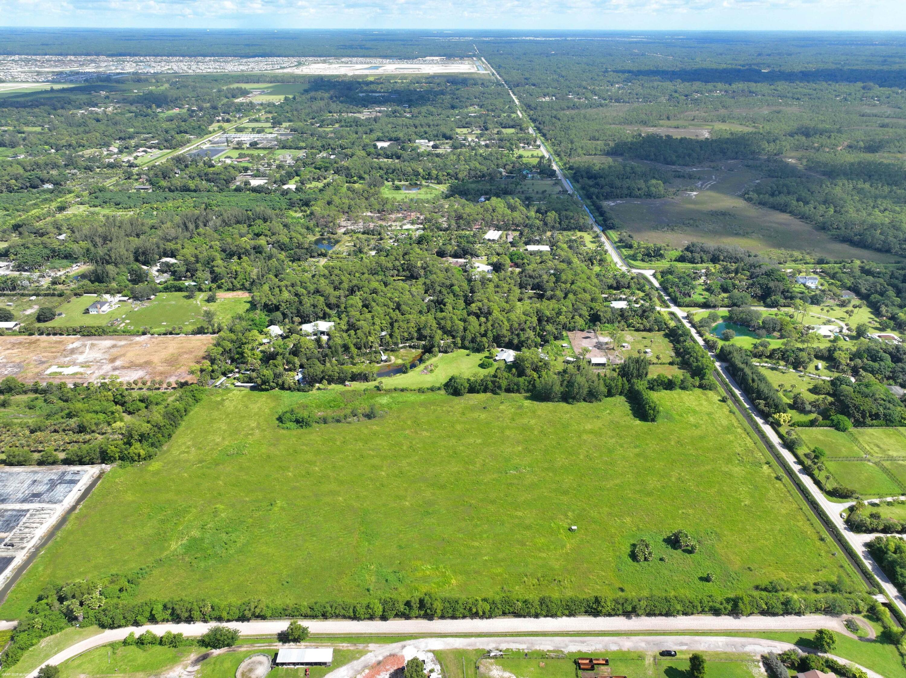 2761 E Road Loxahatchee Groves, FL 33470 - Photo 5 of 20 a view of a field with an ocean