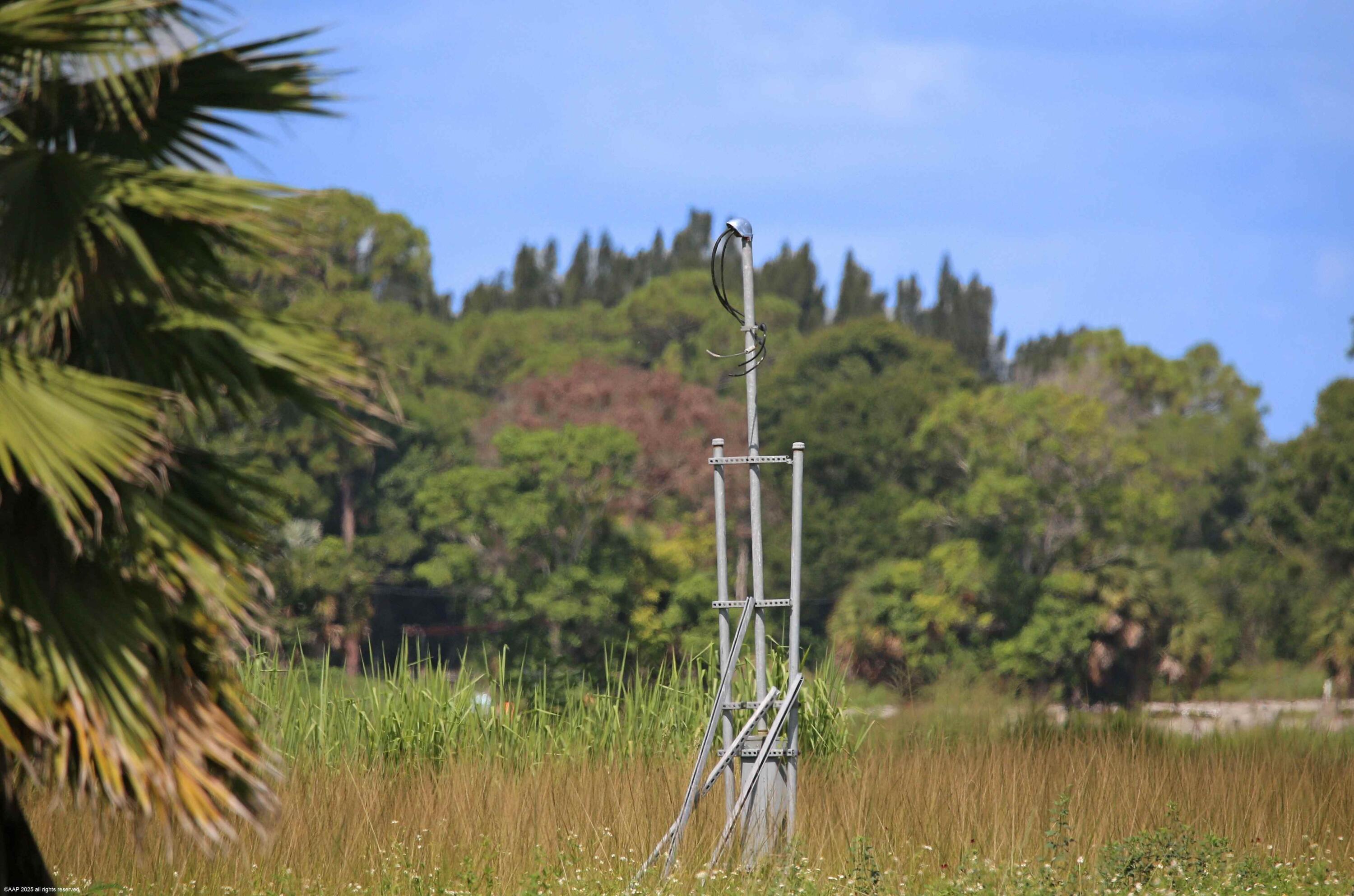 2761 E Road Loxahatchee Groves, FL 33470 - Photo 10 of 20 a view of a lake with a mountain in the background