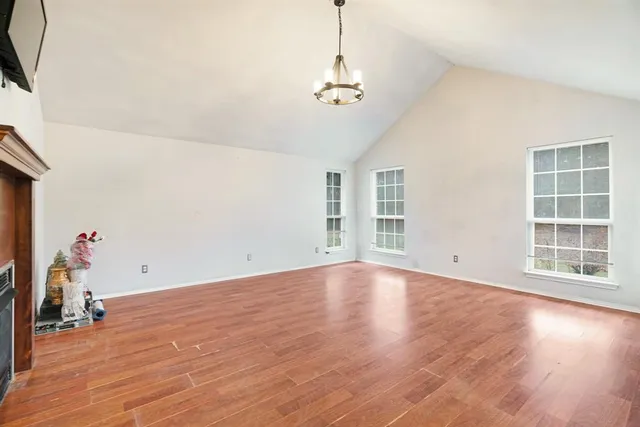 a view of livingroom with wooden floor and stairs