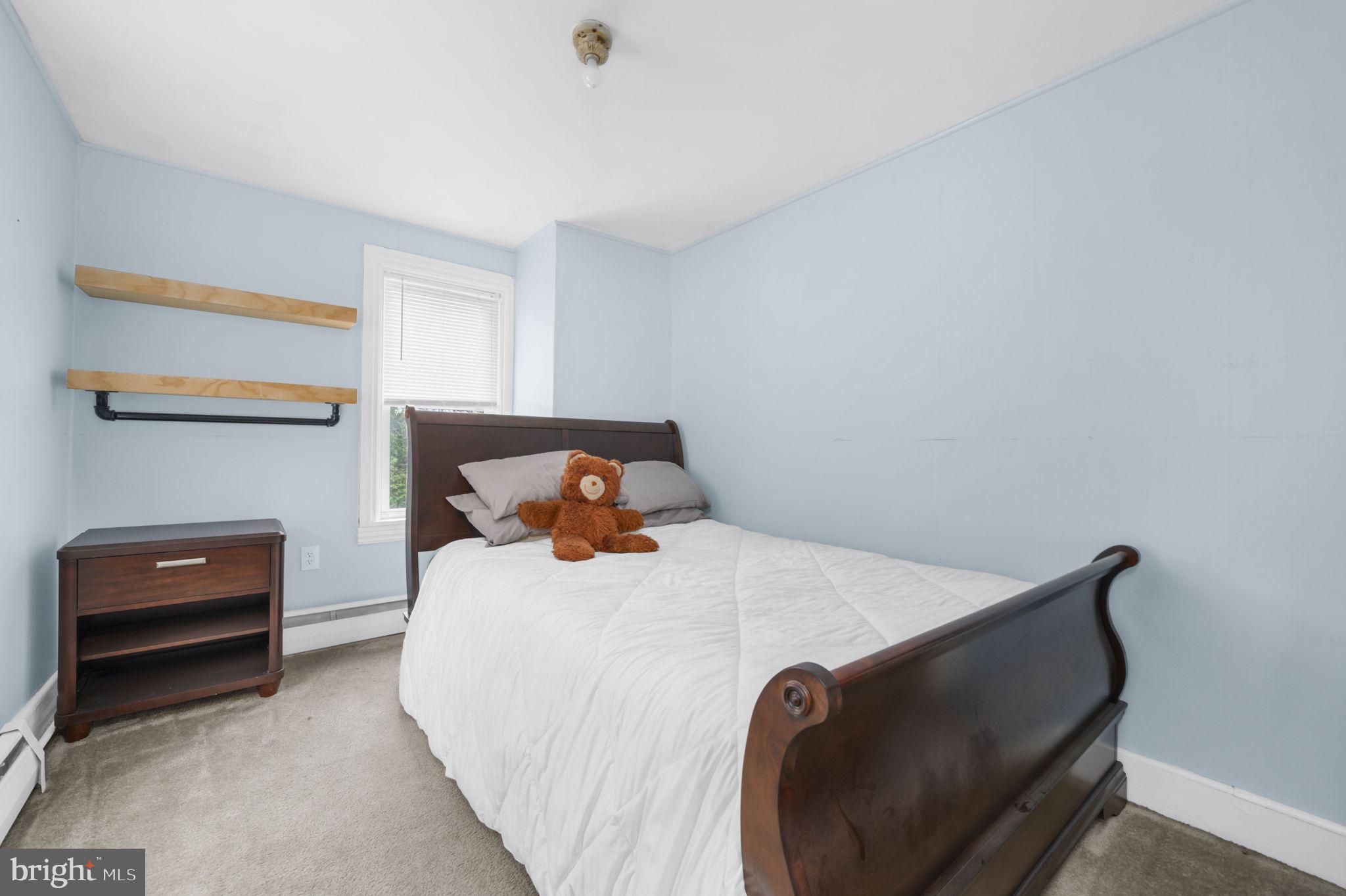 103 Gravel Pike Green Lane, PA 18054 - Photo 17 of 43 a bedroom with a bed and a desk