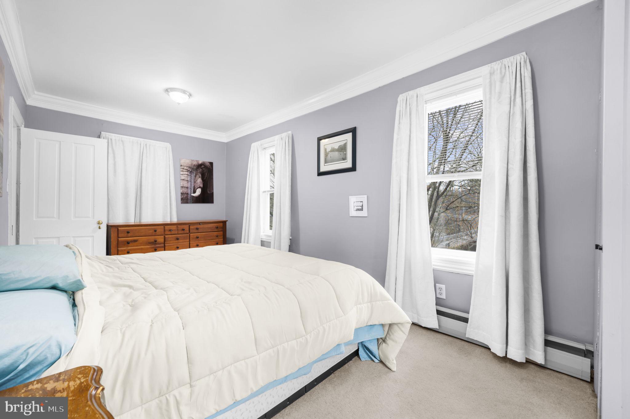 103 Gravel Pike Green Lane, PA 18054 - Photo 19 of 43 a spacious bedroom with a bed and a window