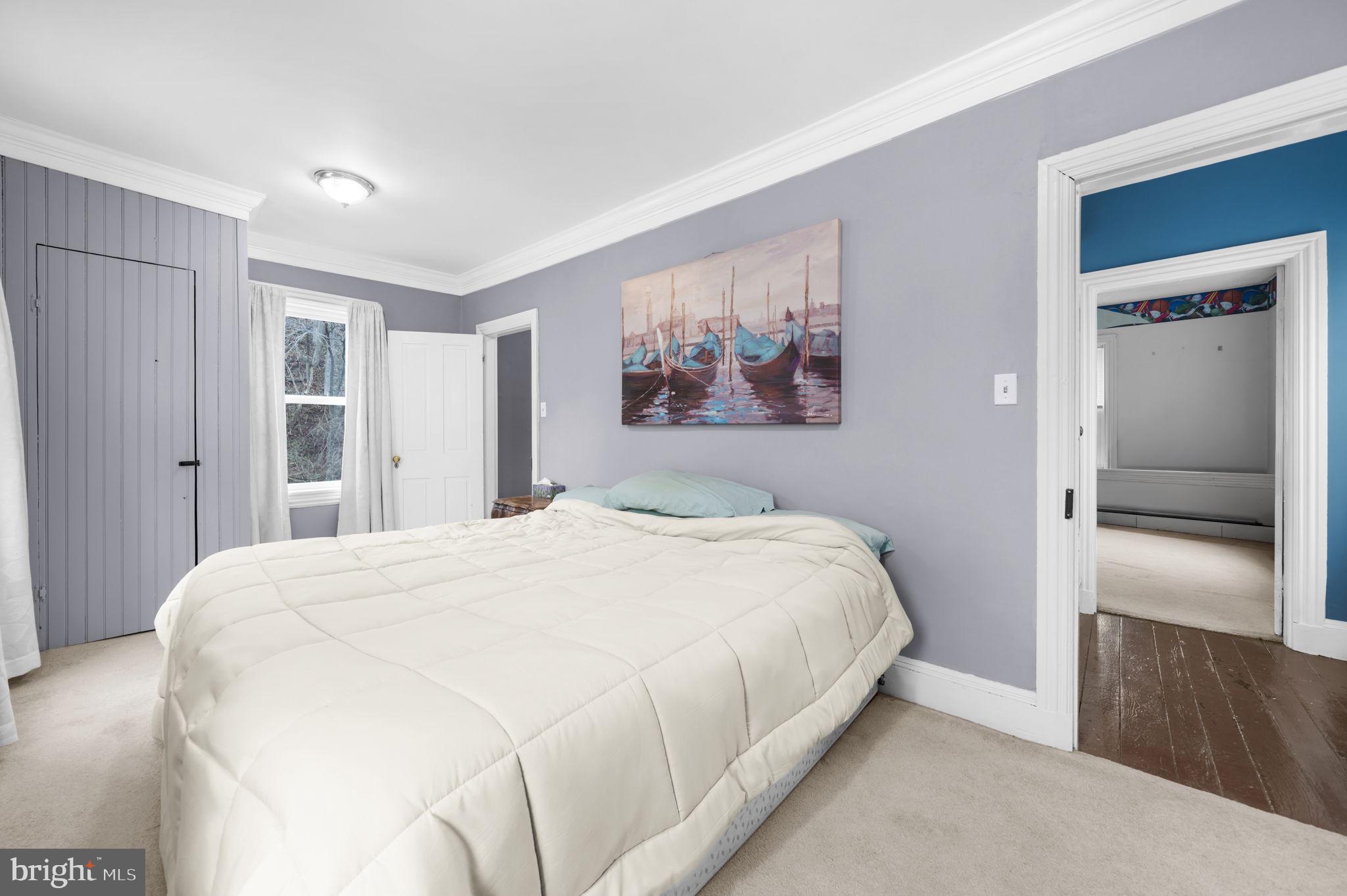 103 Gravel Pike Green Lane, PA 18054 - Photo 20 of 43 a bedroom with a bed and a painting on the wall