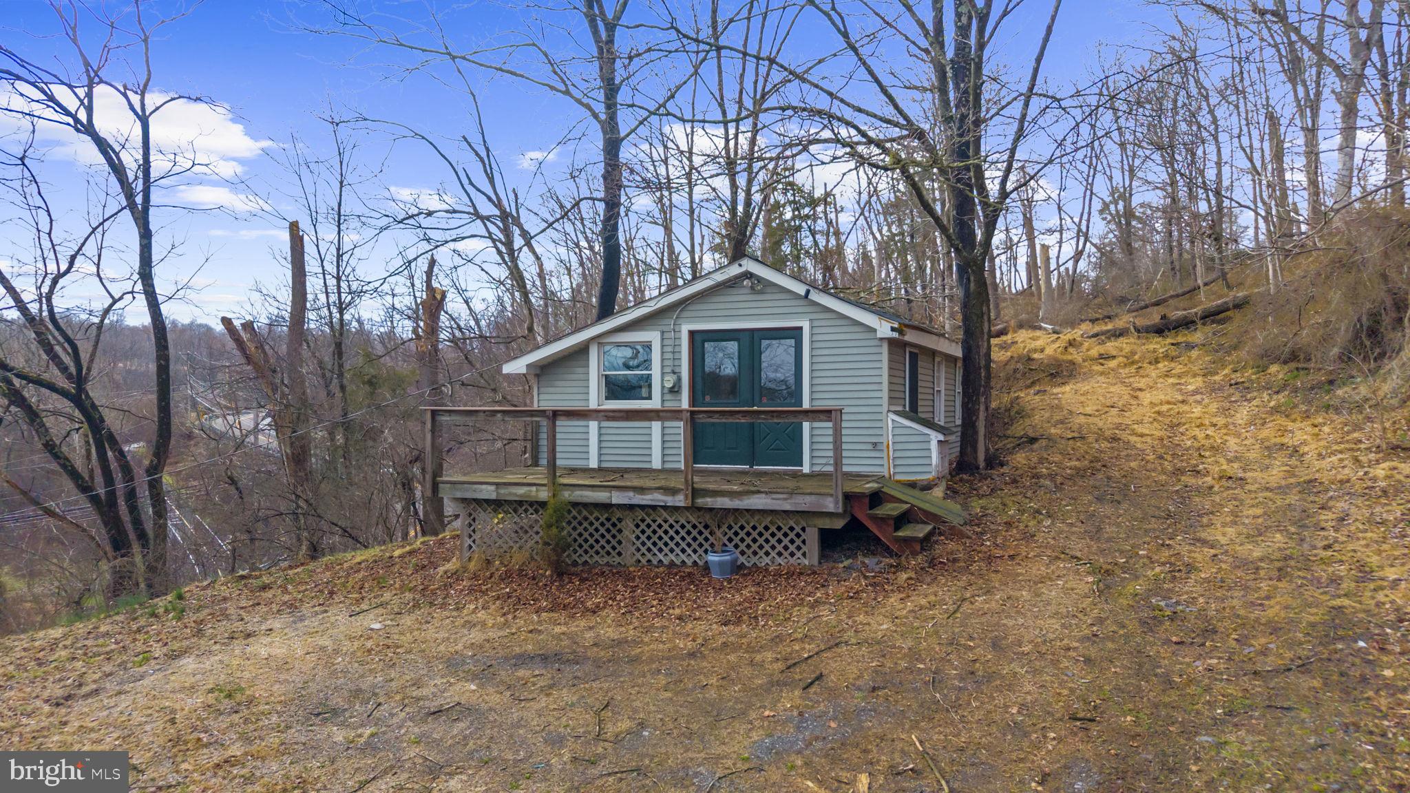 103 Gravel Pike Green Lane, PA 18054 - Photo 2 of 43 a backyard of a house with table and chairs