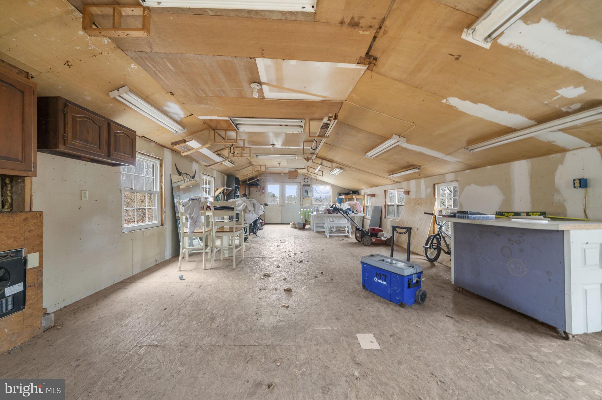 103 Gravel Pike Green Lane, PA 18054 - Photo 34 of 43 a view of a storage room with wooden shelves