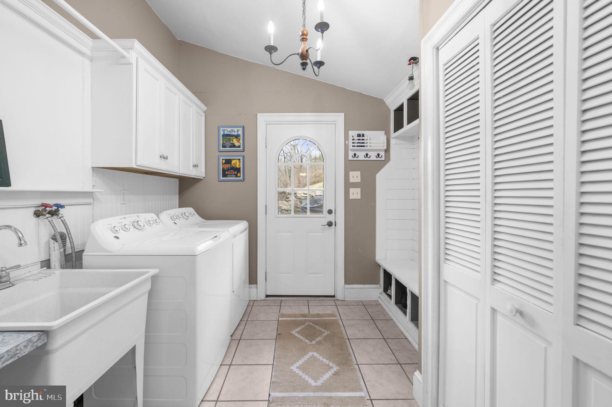 103 Gravel Pike Green Lane, PA 18054 - Photo 7 of 43 a view of storage room with washer and dryer