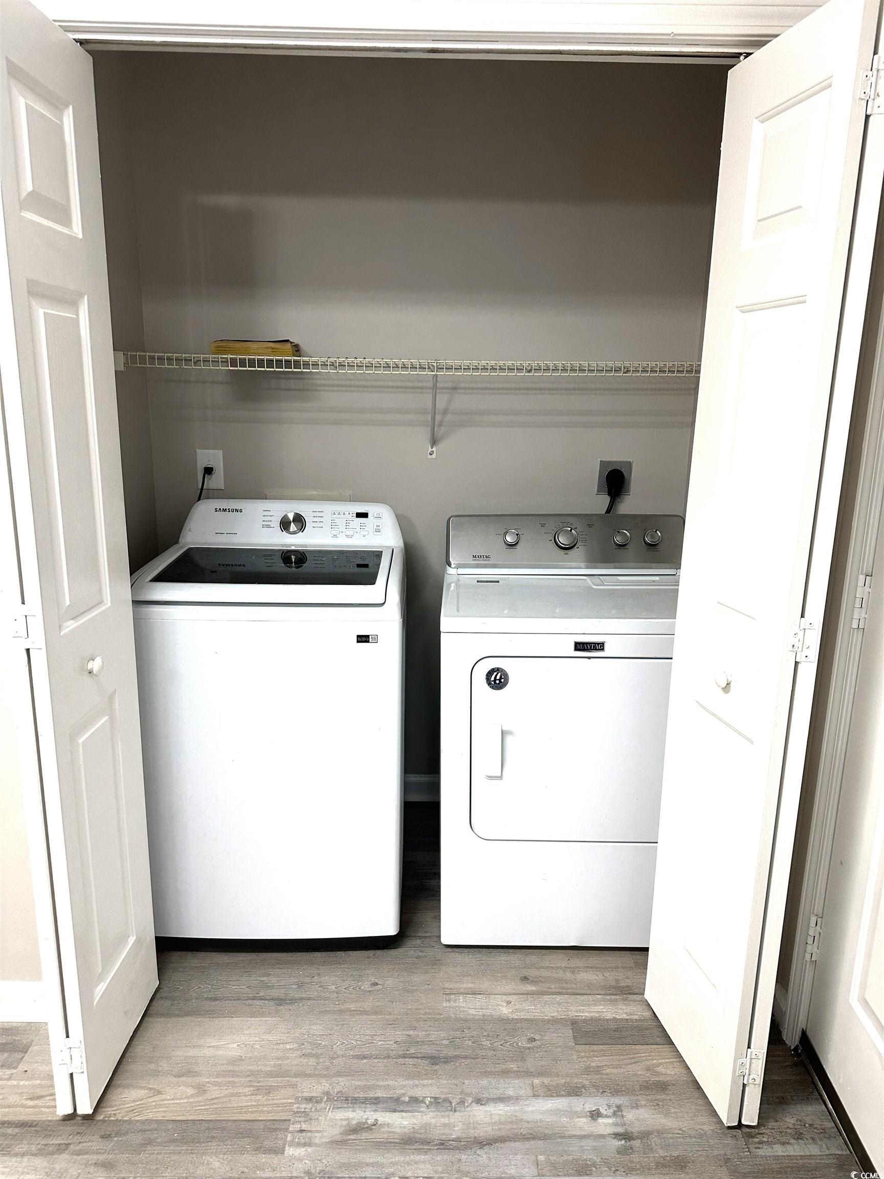 178 Beaver Pond Loop, Unit 60 Pawleys Island, SC 29585 - Photo 5 of 21 Laundry area with light wood-style floors and washing machine and dryer