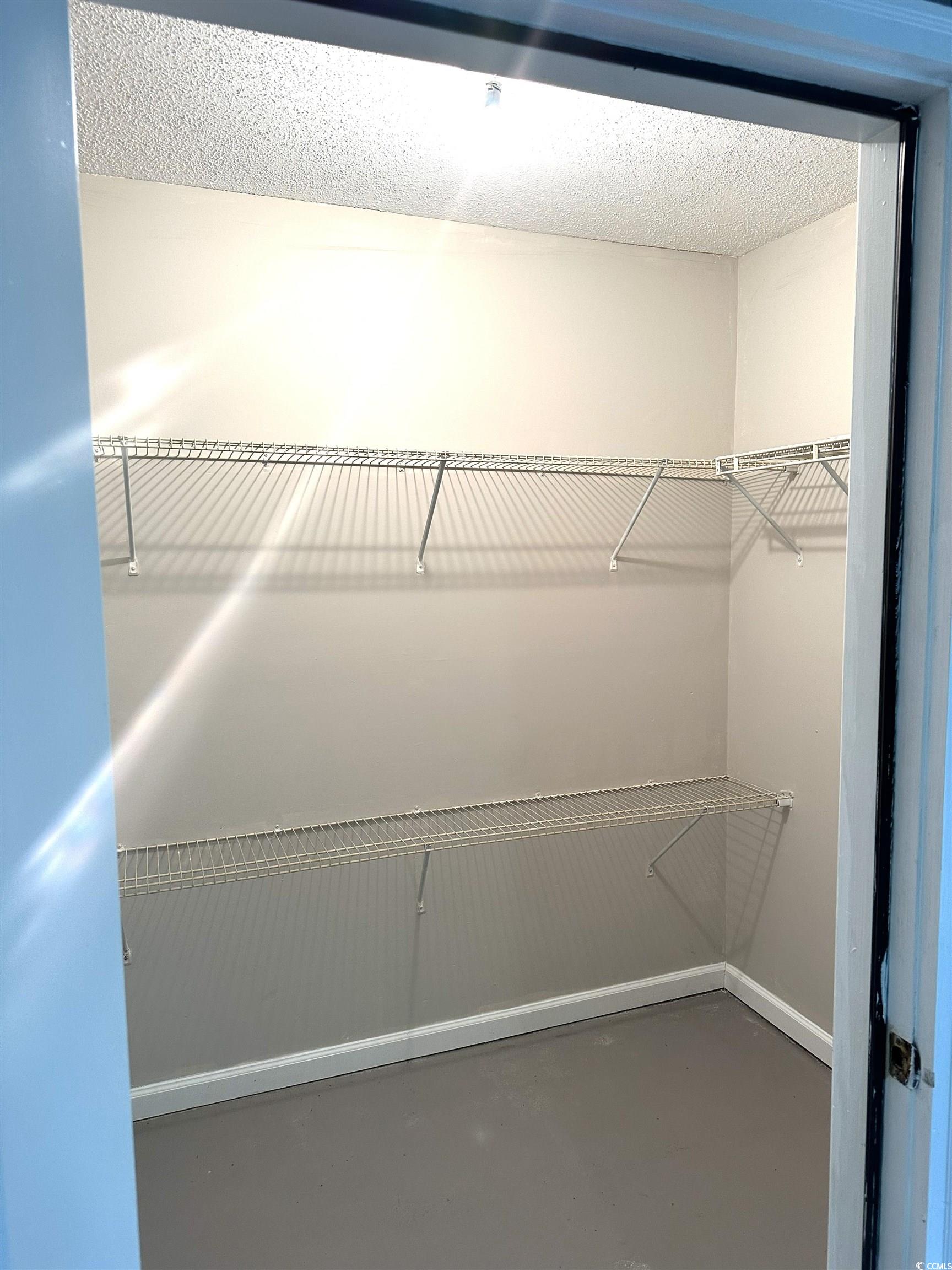 178 Beaver Pond Loop, Unit 60 Pawleys Island, SC 29585 - Photo 8 of 21 View of spacious closet connected to sunroom