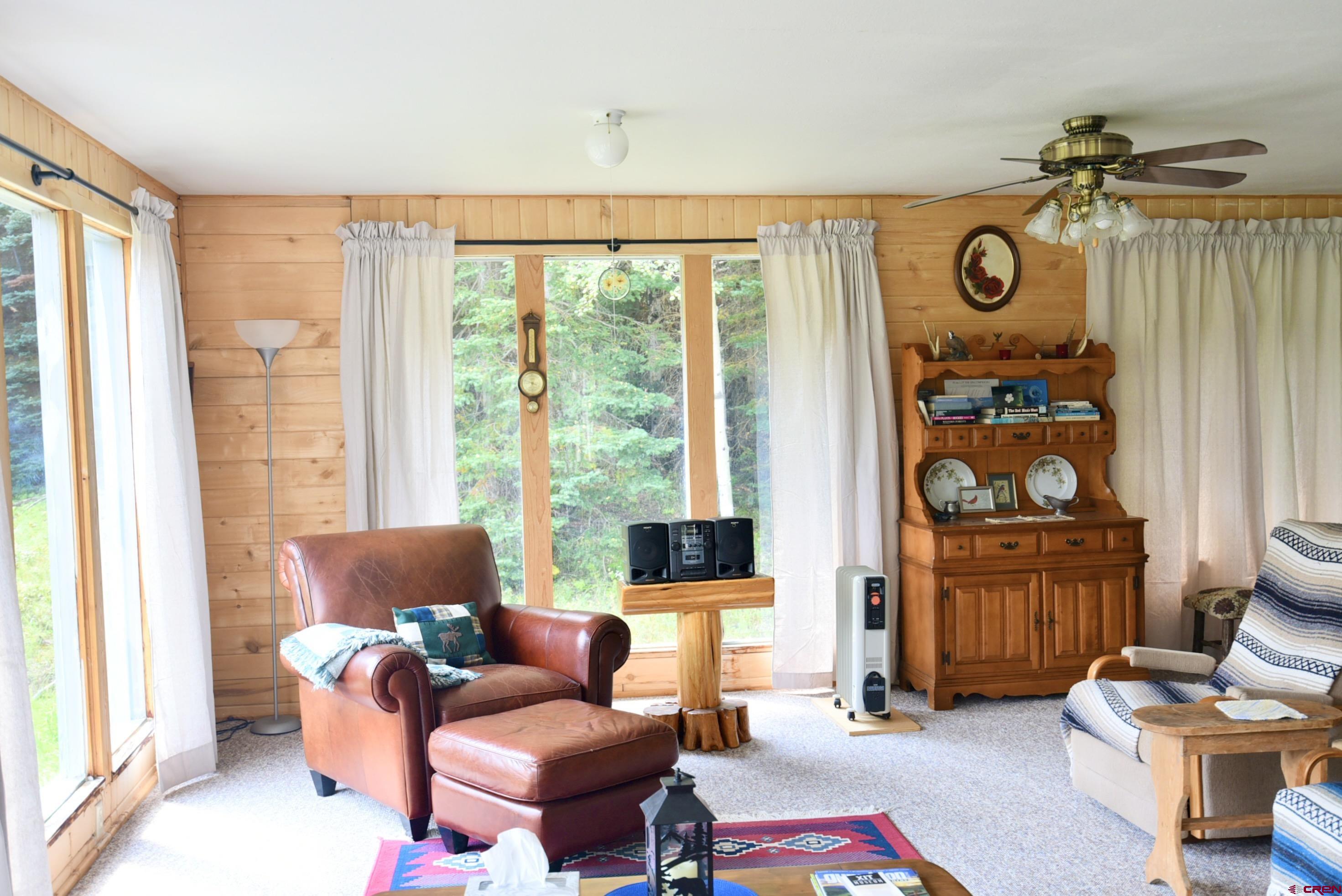 704 Hampton Road Montrose, CO 81220 - Photo 11 of 45 a living room with furniture and a window