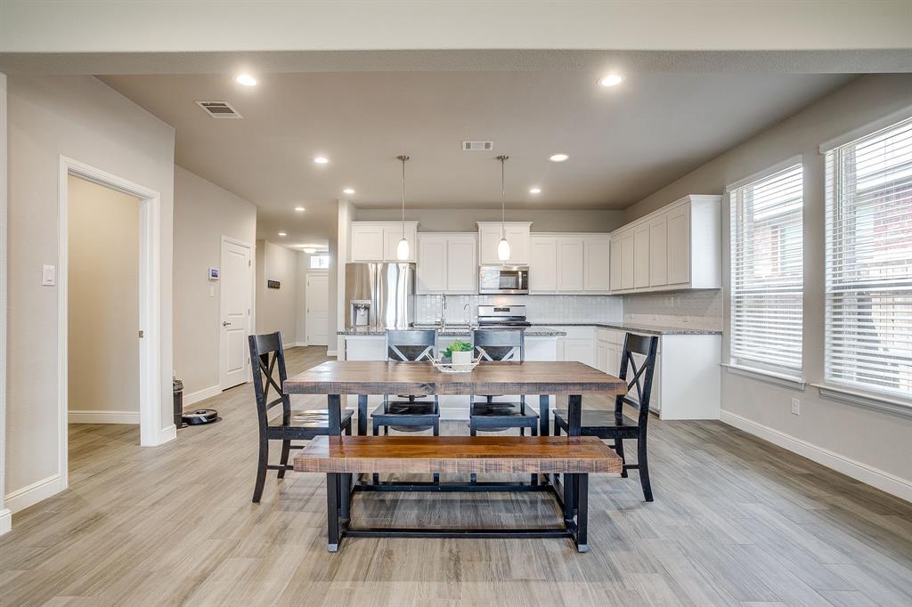 2361 Waggoner Rnch Drive Weatherford, TX 76087 - Photo 7 of 19 a view of a dining room with furniture and wooden floor