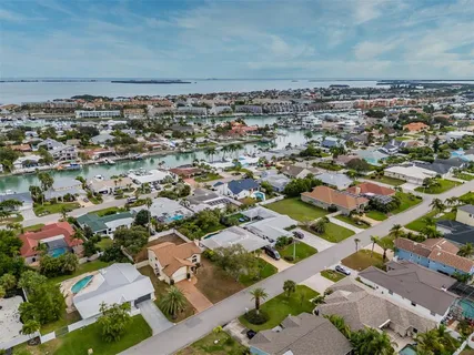 an aerial view of a house with outdoor space
