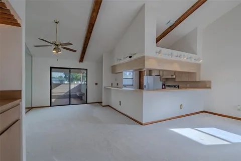 a view of a big room with closet and windows