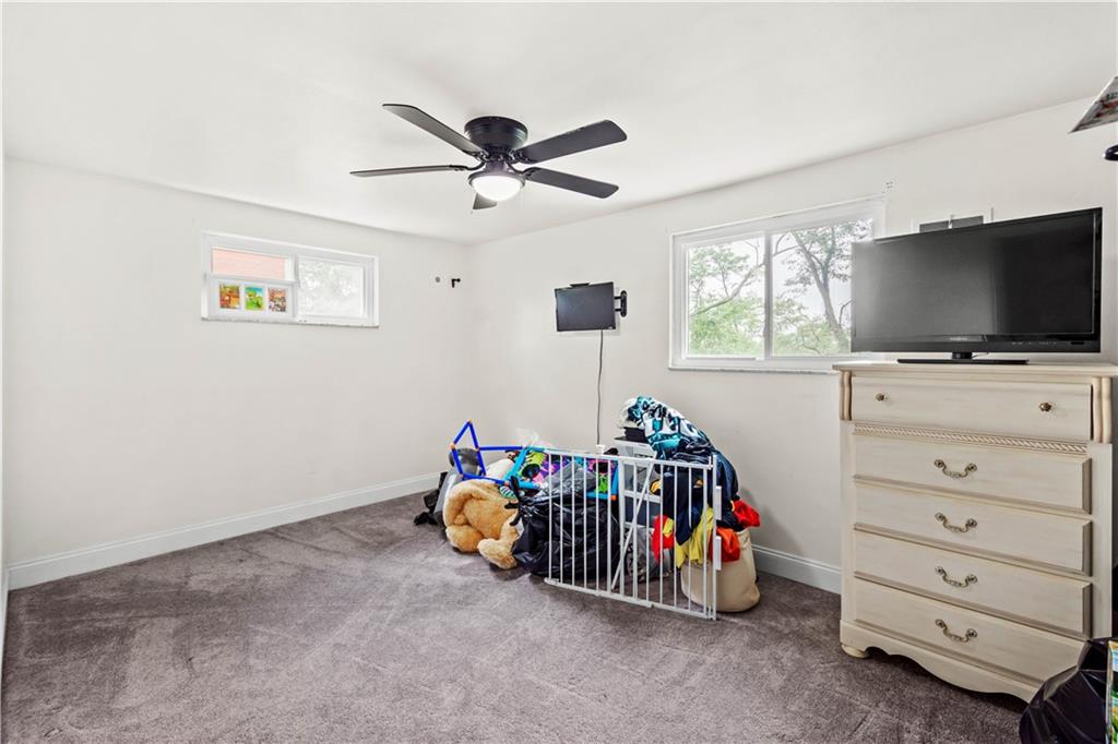 449 Decatur Avenue Pittsburgh, PA 15221 - Photo 14 of 24 a children room with toys and a flat screen tv