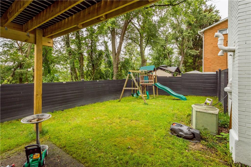 449 Decatur Avenue Pittsburgh, PA 15221 - Photo 18 of 24 a backyard of a house with table and chairs