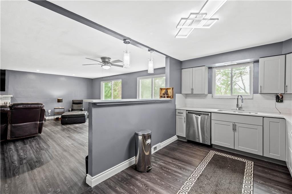 449 Decatur Avenue Pittsburgh, PA 15221 - Photo 3 of 24 a kitchen with sink refrigerator and window