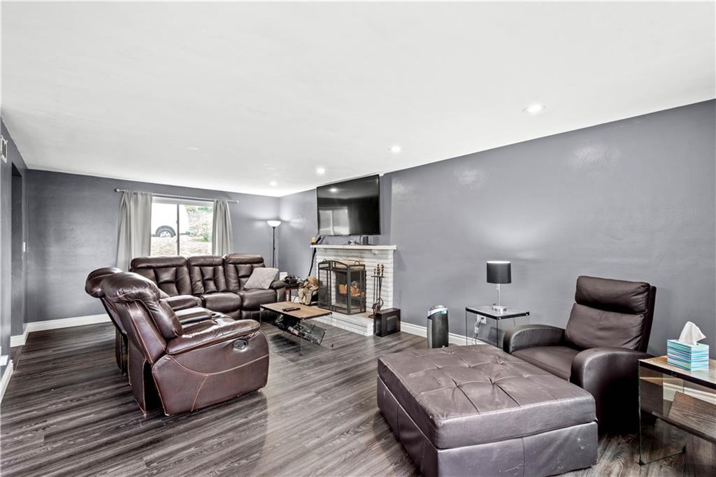 449 Decatur Avenue Pittsburgh, PA 15221 - Photo 6 of 24 a living room with furniture and a flat screen tv