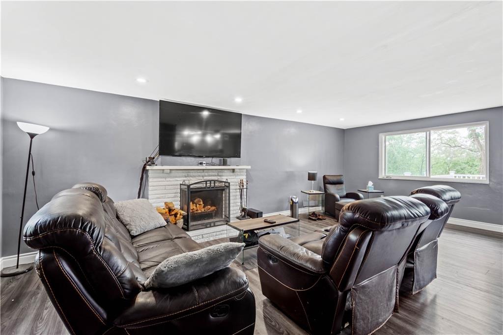 449 Decatur Avenue Pittsburgh, PA 15221 - Photo 7 of 24 a living room with furniture and a flat screen tv