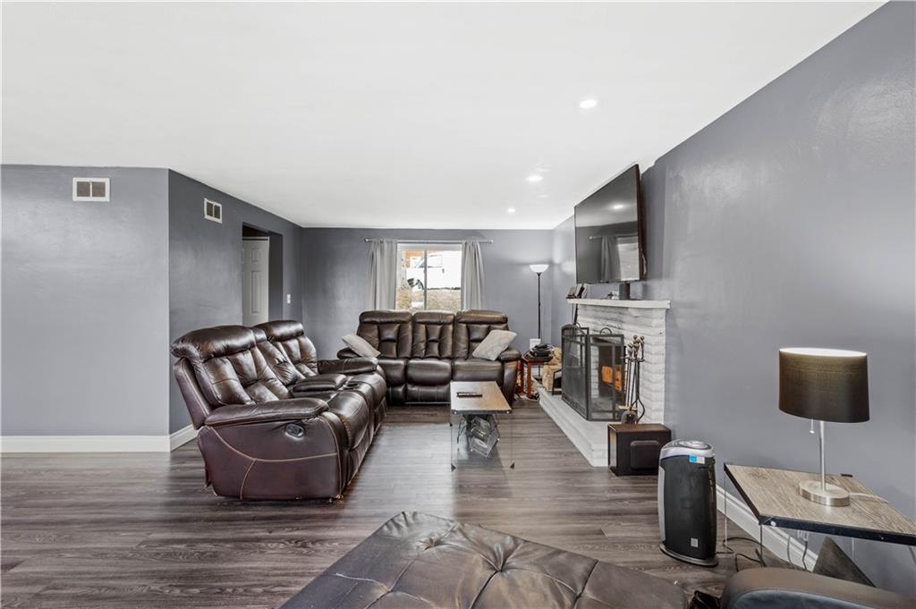 449 Decatur Avenue Pittsburgh, PA 15221 - Photo 8 of 24 a living room with furniture and a flat screen tv