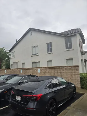 a view of a car parked in front of a house