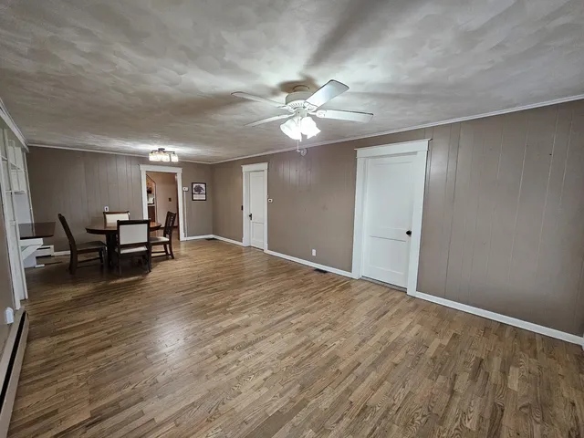 a view of a livingroom with furniture nad wooden floor