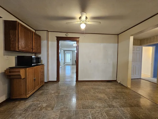 a view of a kitchen with a sink and cabinets