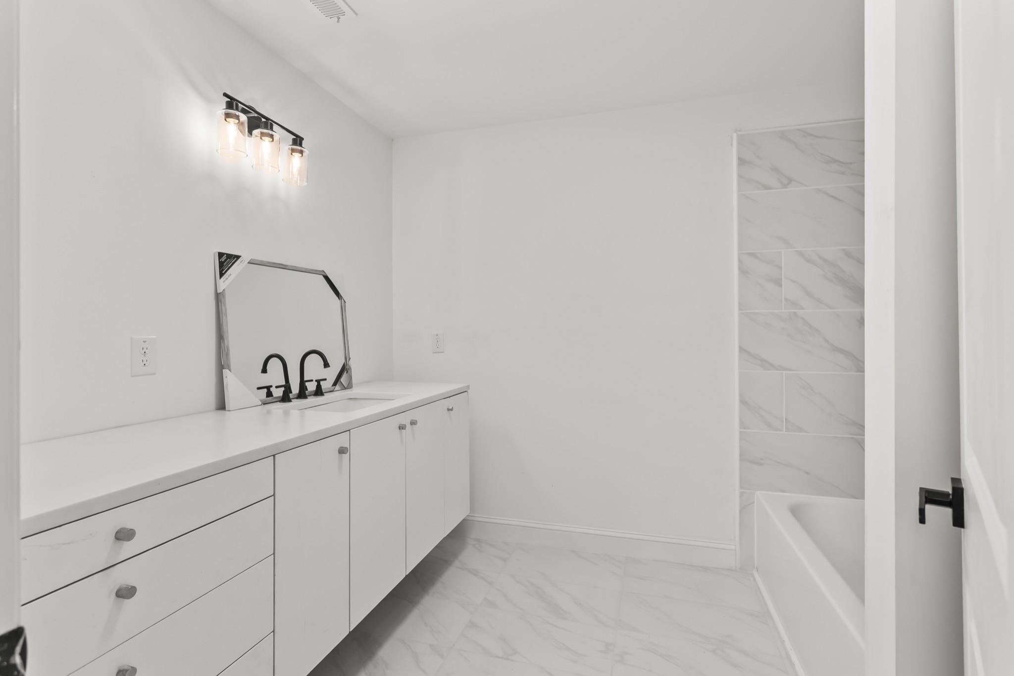 8637 Dog Branch Road Mount Pleasant, TN 38474 - Photo 29 of 44 a bathroom with a sink and mirror