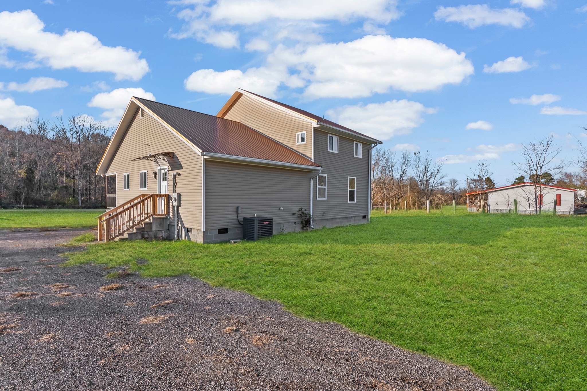 8637 Dog Branch Road Mount Pleasant, TN 38474 - Photo 36 of 44 a backyard of a house with table and chairs