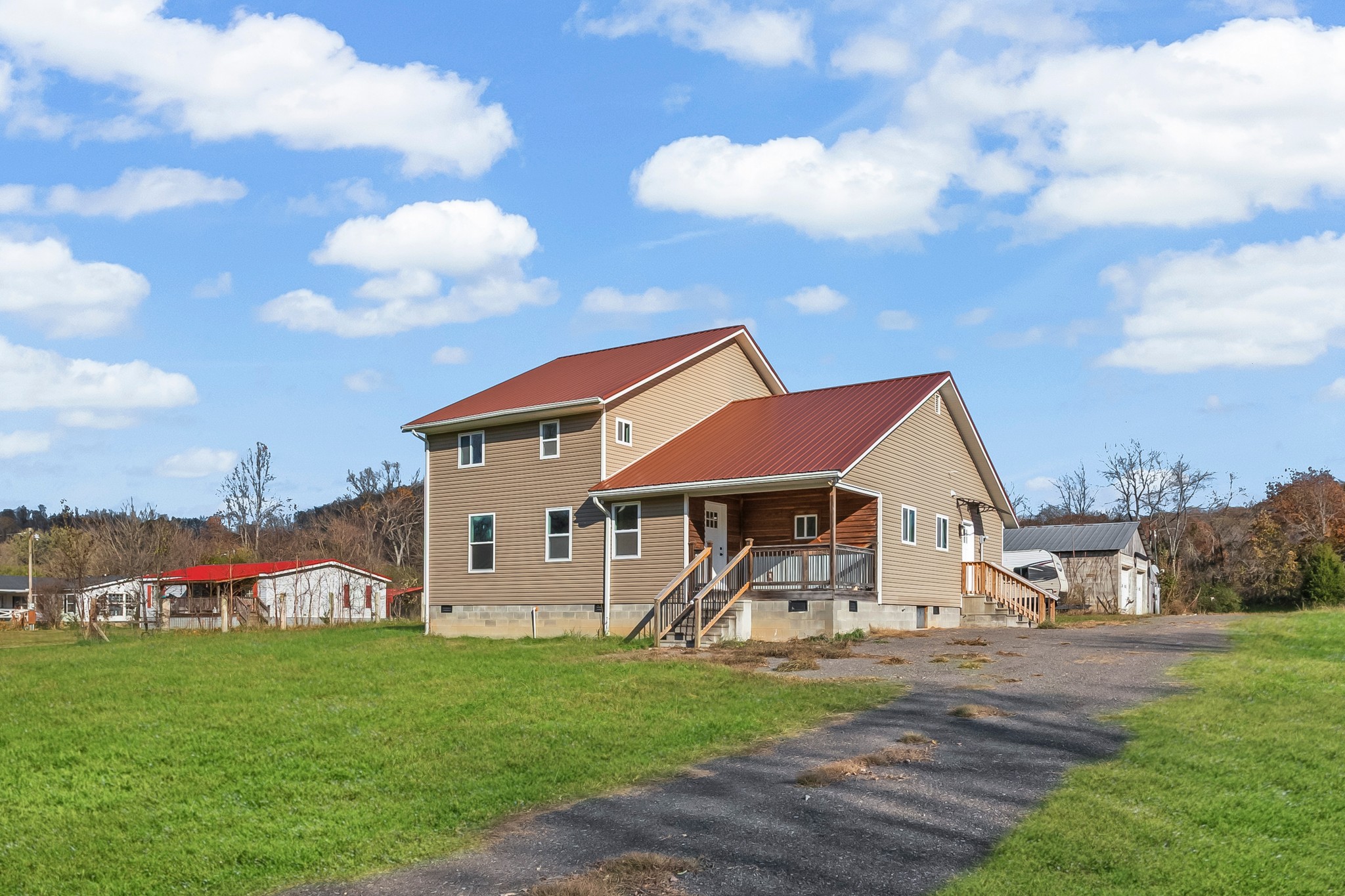 8637 Dog Branch Road Mount Pleasant, TN 38474 - Photo 40 of 44 a view of a house with a yard