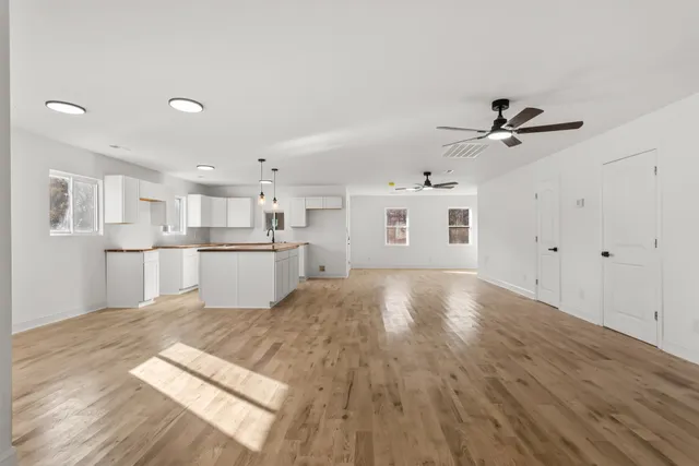 a view of kitchen with wooden floor and window